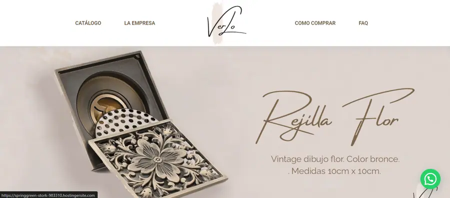 Rejilla de ducha de bronce con diseño floral vintage sobre fondo crema en una interfaz de tienda online.